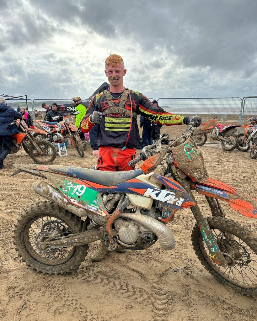 Alex Dawson on the beach at Weston Beach Race 2023 with his off-road bike and running DP brakes brake pads